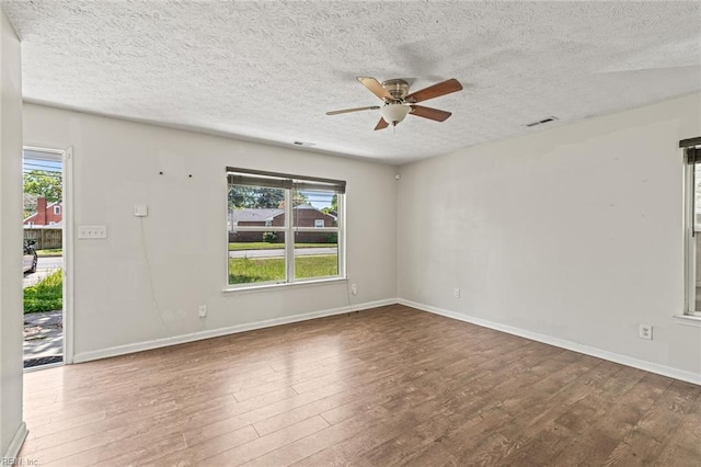 3605 Shell Rd, Hampton, VA 23661 - empty room with a wealth of natural light, wood finished floors, a ceiling fan, and visible vents