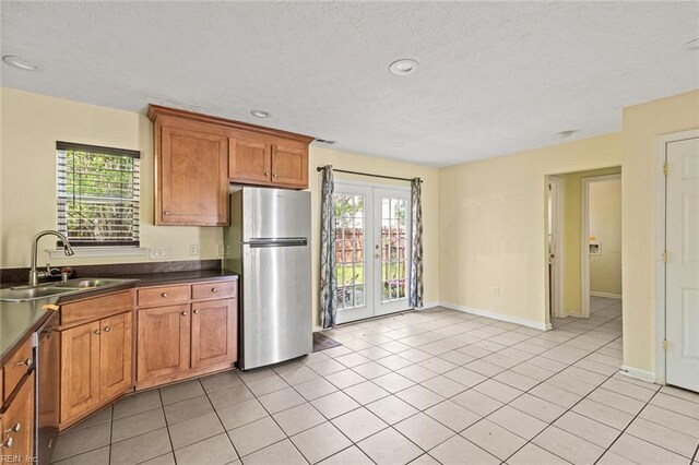 3605 Shell Rd, Hampton, VA 23661 - kitchen with a wealth of natural light, dark countertops, appliances with stainless steel finishes, and a sink
