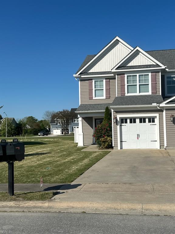 114 Spinnaker St Unit A, Elizabeth City, NC 27909 - view of front of home with a garage, roof with shingles, a front yard, and concrete driveway