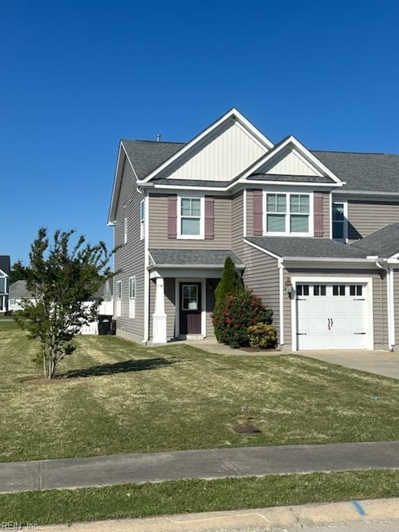 114 Spinnaker St Unit A, Elizabeth City, NC 27909 - view of front facade featuring concrete driveway, a front lawn, board and batten siding, and a garage