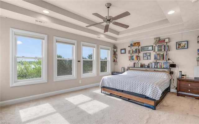 bedroom featuring recessed lighting, a raised ceiling, visible vents, carpet floors, and baseboards
