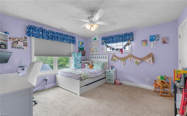 bedroom with visible vents, carpet flooring, ceiling fan, and multiple windows