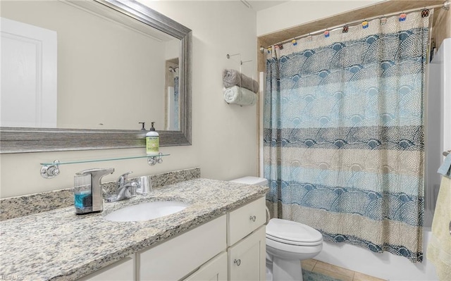 bathroom with shower / tub combo with curtain, tile patterned floors, vanity, and toilet