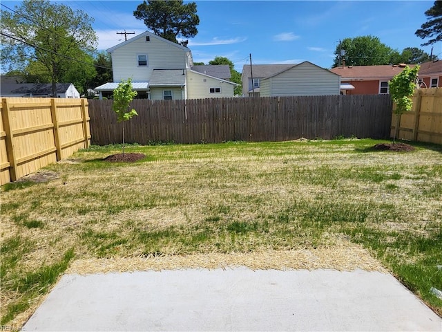 view of yard with a fenced backyard