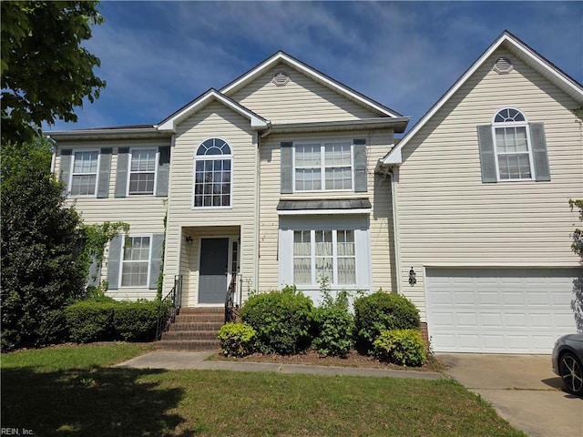 view of front of property with driveway and an attached garage