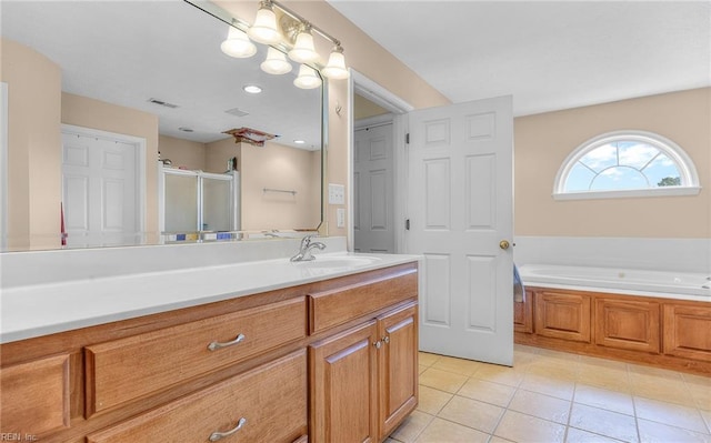 bathroom with a shower stall, vanity, a bath, visible vents, and tile patterned flooring