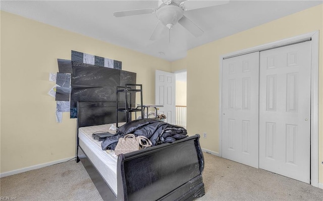bedroom featuring baseboards, a ceiling fan, carpet floors, and a closet