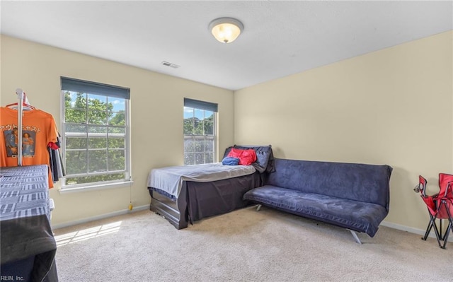bedroom with visible vents, baseboards, and carpet floors