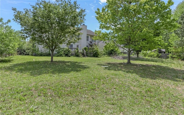 view of yard featuring a wooden deck