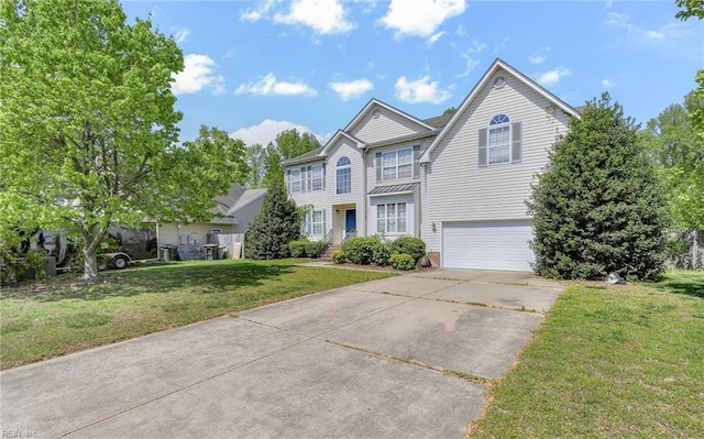 view of front of property featuring concrete driveway, a garage, and a front lawn