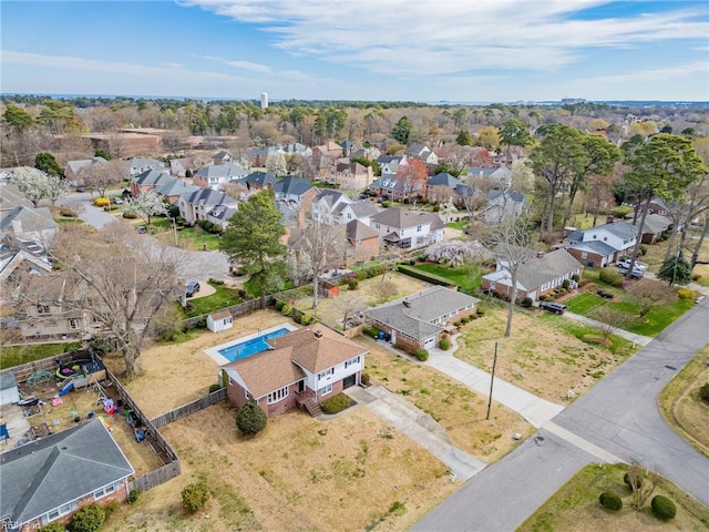 birds eye view of property with a residential view