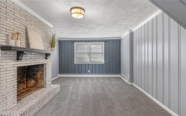 unfurnished living room with a fireplace, carpet, baseboards, and ornamental molding