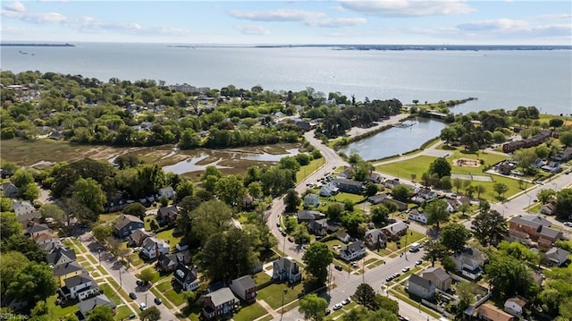 drone / aerial view with a residential view and a water view