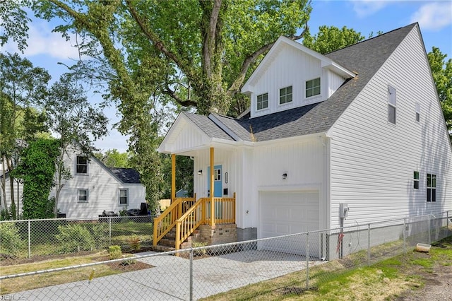 modern inspired farmhouse with board and batten siding, fence private yard, roof with shingles, and concrete driveway