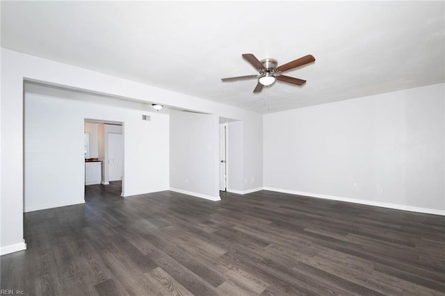 unfurnished living room featuring a ceiling fan, baseboards, and dark wood-type flooring