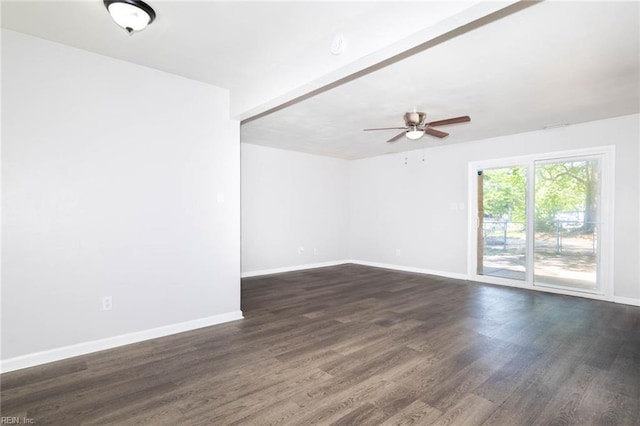 empty room featuring ceiling fan, dark wood finished floors, and baseboards