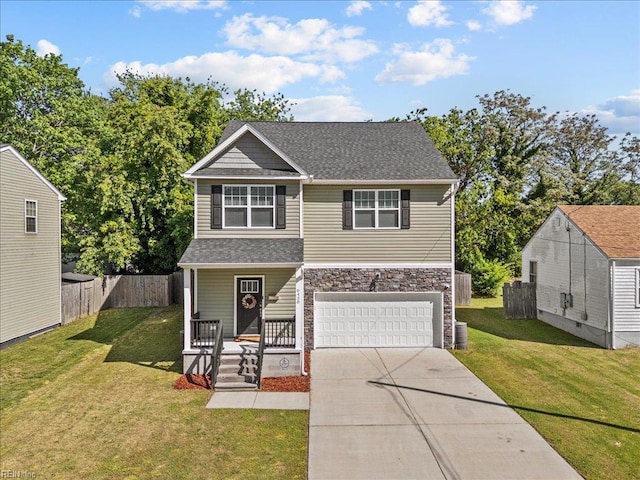 traditional-style home featuring a garage, fence, covered porch, stone siding, and driveway
