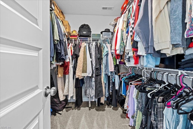 walk in closet with carpet and visible vents