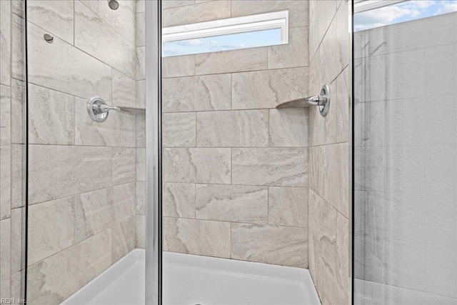 full bath featuring a shower stall