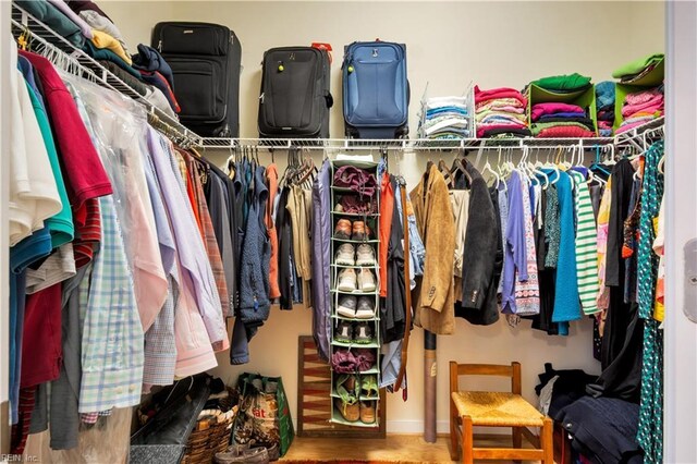 spacious closet with wood finished floors