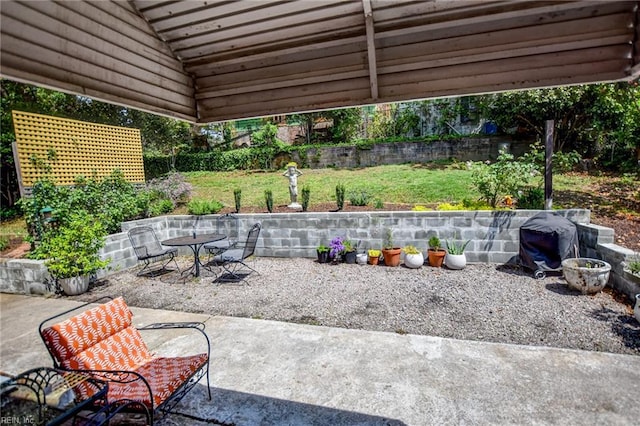view of patio featuring fence and outdoor dining space