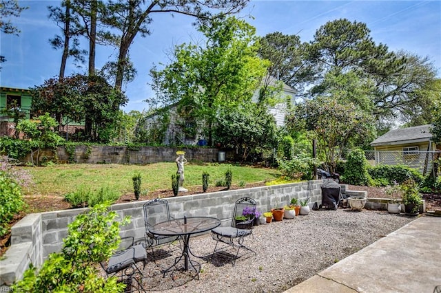 view of patio / terrace with outdoor dining space and a fenced backyard