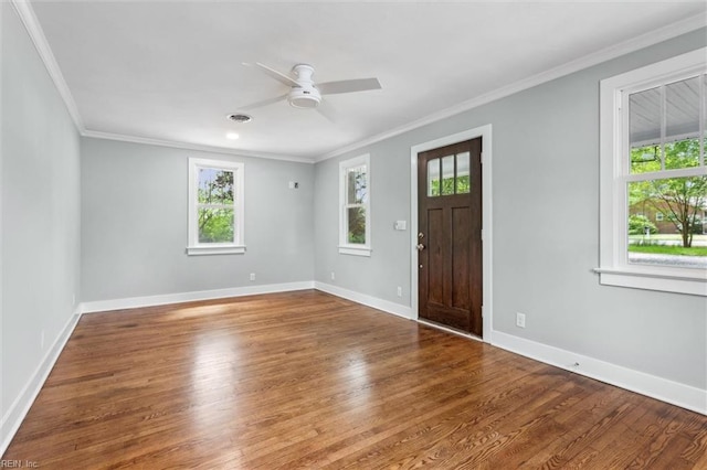 entrance foyer featuring wood finished floors, a ceiling fan, and ornamental molding