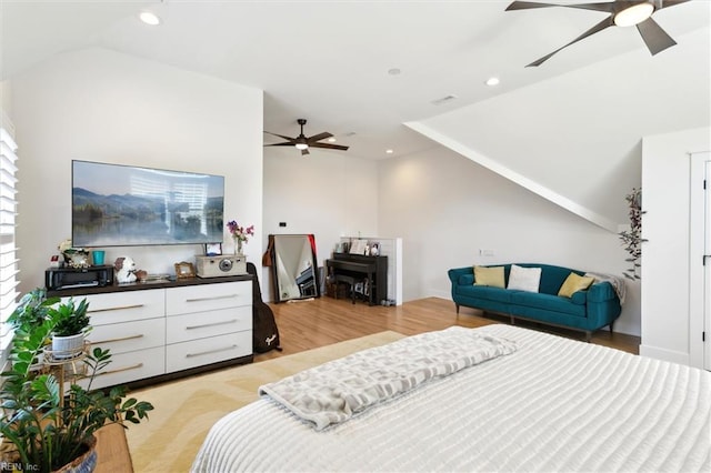 bedroom with recessed lighting, ceiling fan, vaulted ceiling, and light wood finished floors