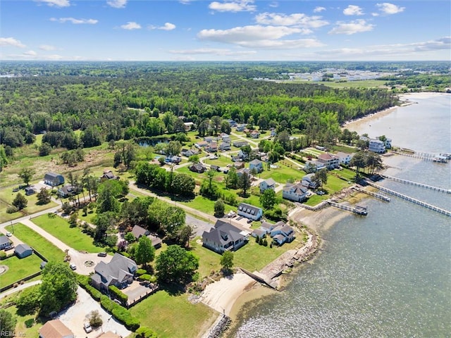 bird's eye view with a water view, a view of trees, and a residential view