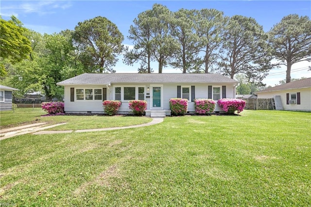 single story home featuring crawl space, fence, and a front yard