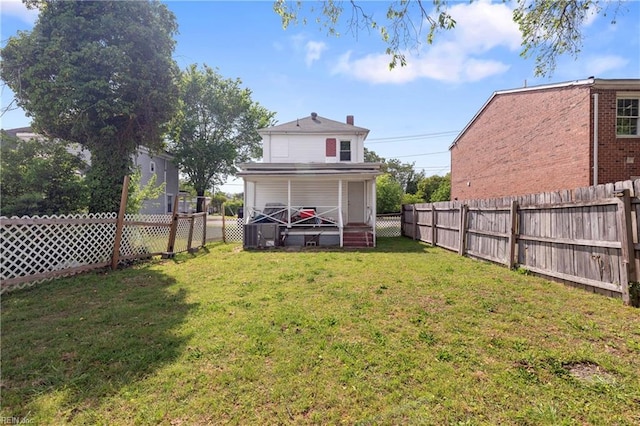 view of yard with a fenced backyard