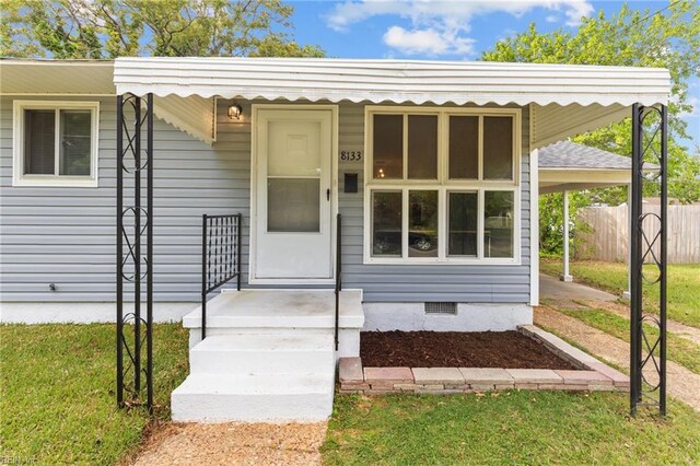 view of front facade with fence and crawl space