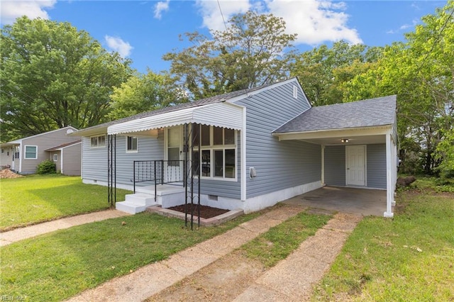 bungalow-style home featuring a shingled roof, a carport, crawl space, a front lawn, and concrete driveway