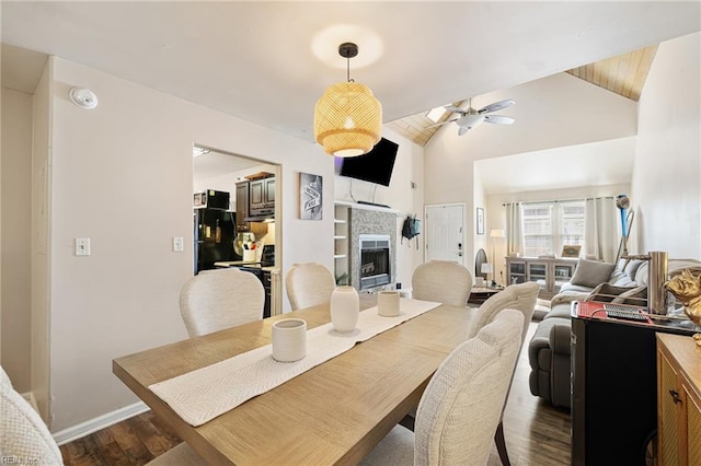 5081 Gatehouse Way, Virginia Beach, VA 23455 - dining room featuring dark wood-style flooring, a fireplace, baseboards, high vaulted ceiling, and a ceiling fan