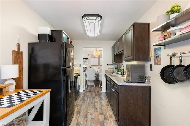 5081 Gatehouse Way, Virginia Beach, VA 23455 - kitchen featuring a sink, light wood-style floors, light countertops, dark brown cabinetry, and black appliances