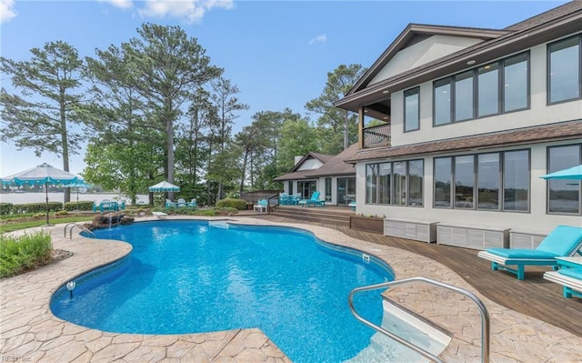 view of swimming pool with a fenced in pool and a patio area