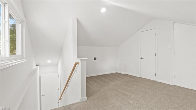bonus room featuring recessed lighting, lofted ceiling, and carpet