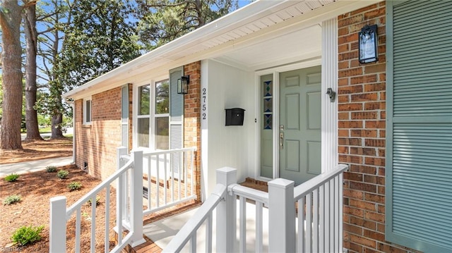 entrance to property with brick siding