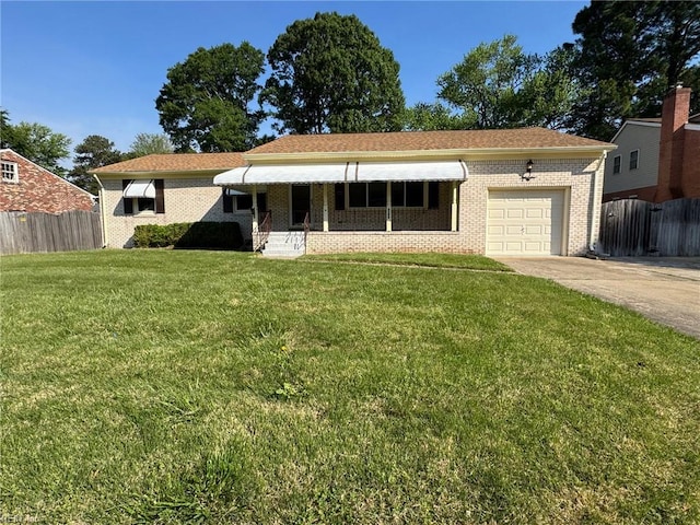 single story home with fence, concrete driveway, a front yard, and a garage