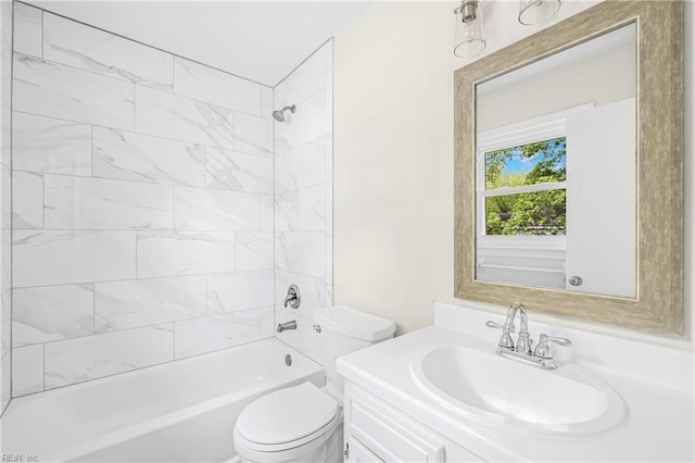 full bath featuring toilet, shower / bathtub combination, and vanity