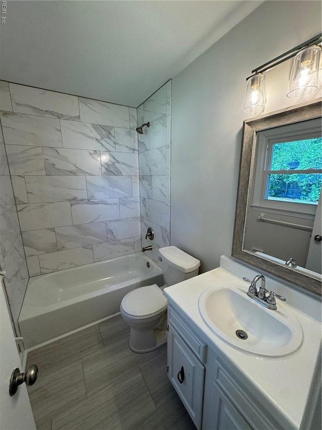 full bath featuring toilet, tub / shower combination, and vanity
