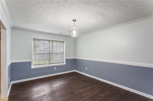 unfurnished room with dark wood finished floors, baseboards, ornamental molding, and a textured ceiling