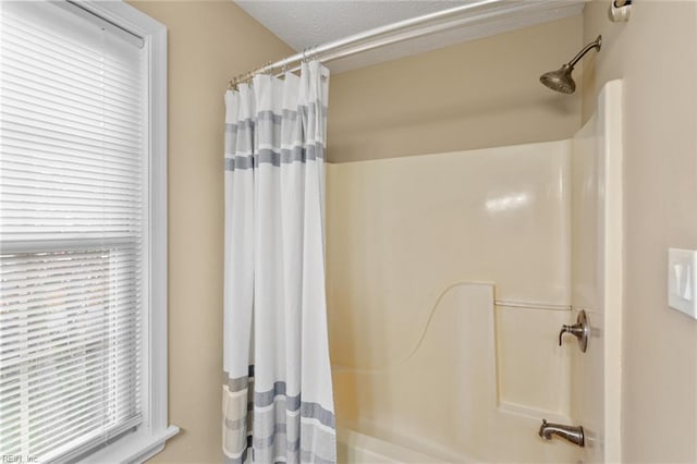 full bathroom with shower / tub combo with curtain