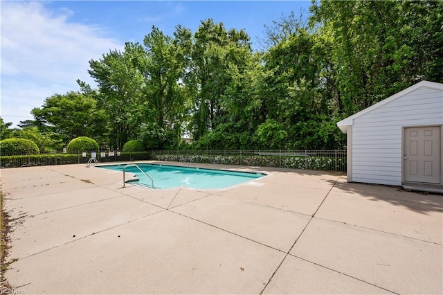 view of pool with a fenced in pool, a patio area, and fence