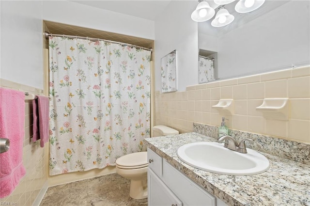 full bathroom with tile walls, an inviting chandelier, toilet, and vanity