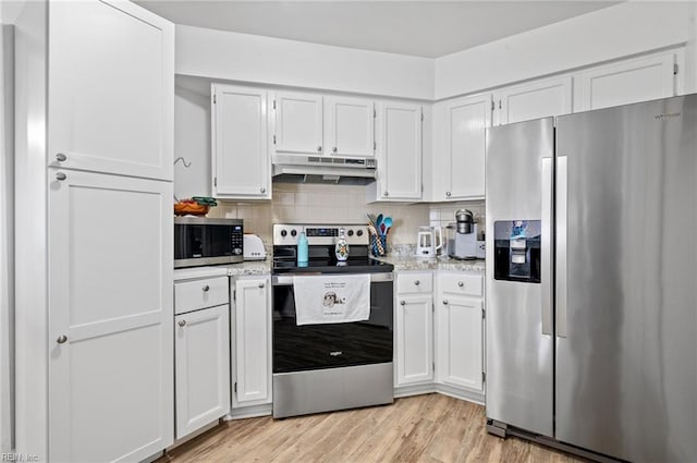 kitchen featuring white cabinets, stainless steel appliances, and under cabinet range hood