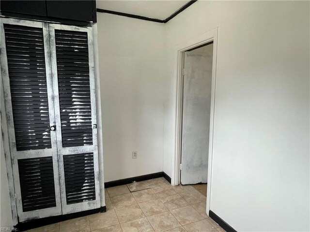 7420 Doummar Dr, Norfolk, VA 23518 - empty room with baseboards, crown molding, and light tile patterned flooring