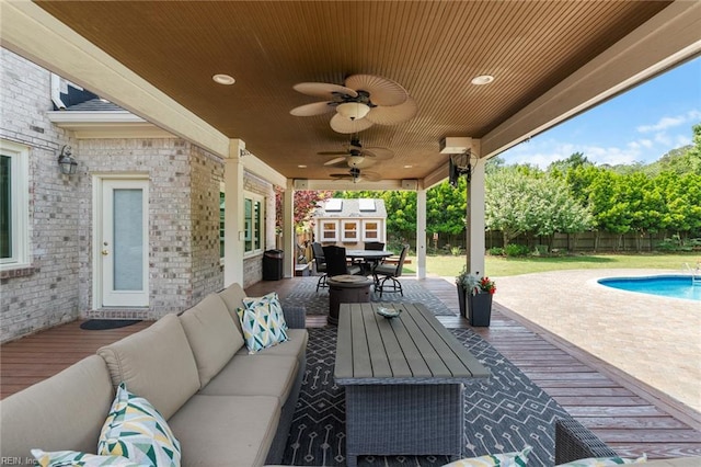 view of patio with a ceiling fan, outdoor dining area, a fenced in pool, a fenced backyard, and outdoor lounge area