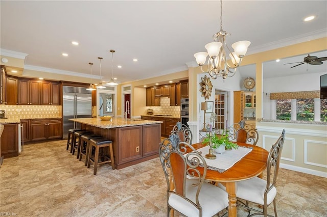 dining room with crown molding, recessed lighting, and ceiling fan with notable chandelier