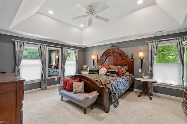 bedroom featuring visible vents, carpet, baseboards, and a tray ceiling